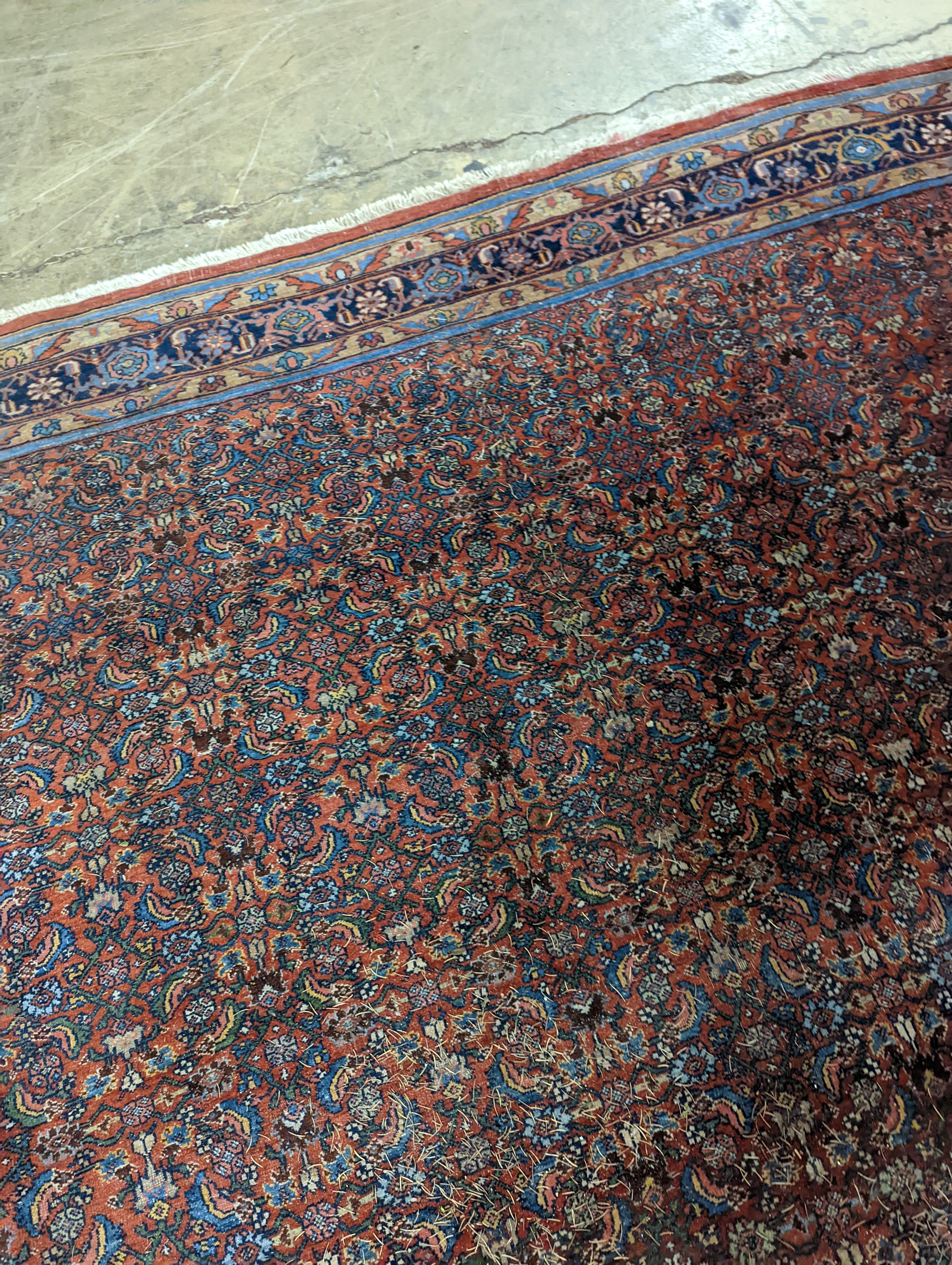 A North West Persian red ground carpet, 360 x 250cm